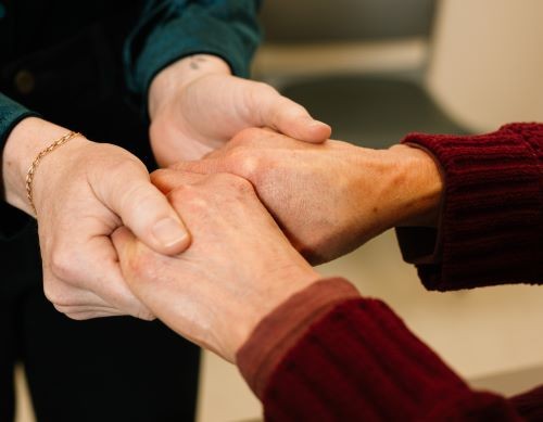 photo of two people's hands holding